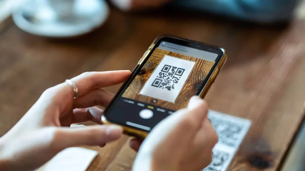4. QR CODES ON RECEIPTS, CARDS, AND THE LOBBY WALL (USED THE RIGHT WAY)